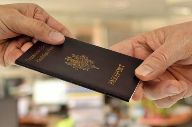 Required Documents to Study Abroad identity concept with a passport held in close up