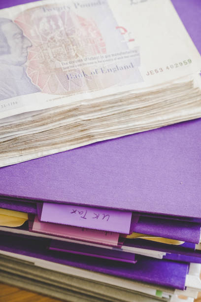 Official documents stacked for UK student bank account: passport, university letterhead, and sterling currency. 