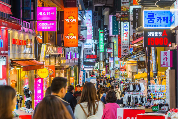view of a bustling Seoul street at night, highlighting the modern K-Culture and technology that drives the study in South Korea trend.