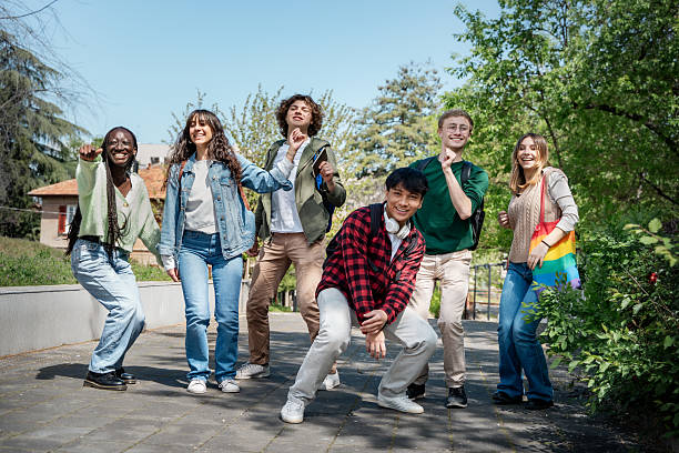 Diverse group of international students socializing on a modern South Korean university campus, symbolizing an inclusive study environment.